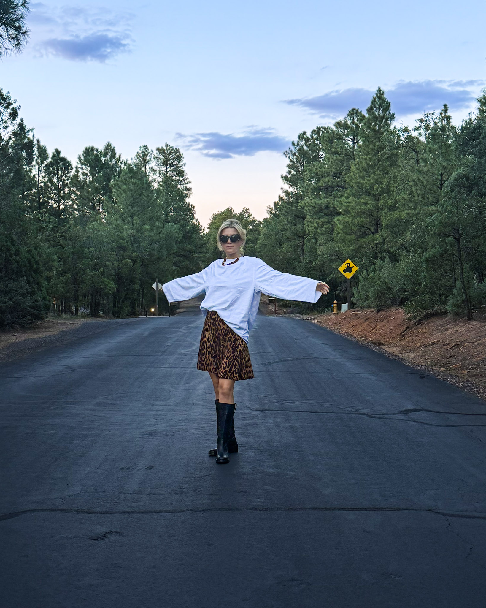 Oversized white tee, leopard-print mini skirt, black boots